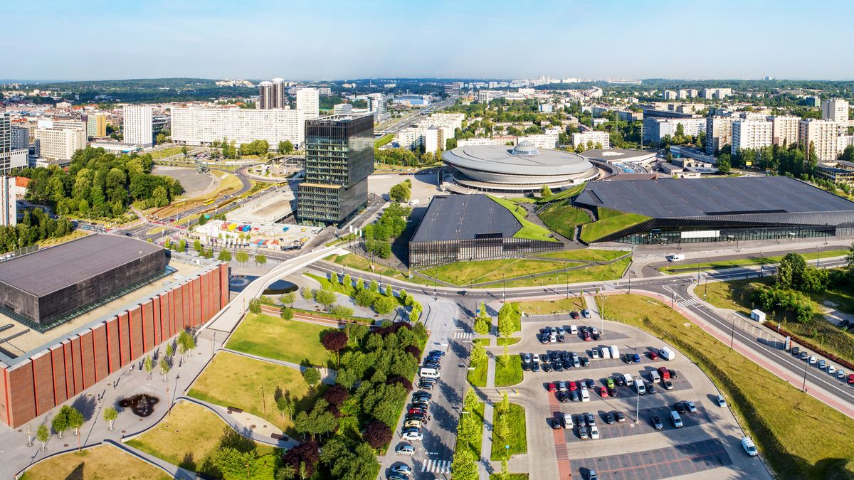 Wide aerial panorama of Katowice city center in PolandKatowice, Poland, city, center, panorama, wide, aerial, skyline, cityscape, Silesia, architecture, modern, building, NOSPR, concert, hall, spodek, saucer, round, international, conference, congress, arena, sports, entertainment, venue, artificial, canyon, recreation, park, parking lot, cars, street, landmark, travel, Silesian, famous, blocks of flats, morning, spring, summer, roof, landscape, fountain, Polish, Europe, European, sightseeing, tourist attraction, katowice, poland, city, center, panorama, wide, aerial, skyline, cityscape, silesia, architecture, modern, building, nospr, concert, hall, spodek, saucer, round, international, conference, congress, arena, sports, entertainment, venue, artificial, canyon, recreation, park, parking lot, cars, street, landmark, travel, silesian, famous, blocks of flats, morning, spring, summer, roof, landscape, fountain, polish, europe, european, sightseeing, tourist attraction