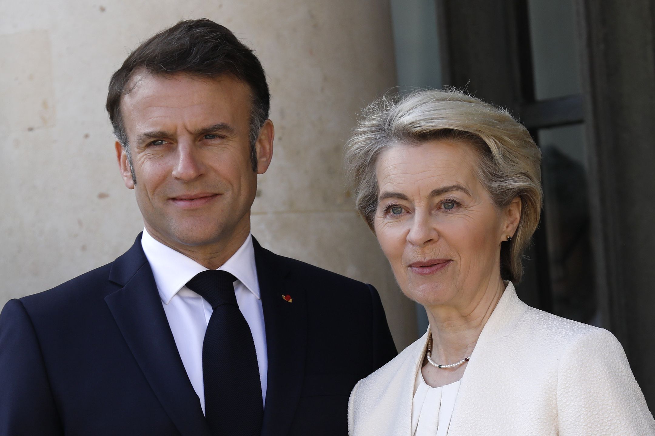PARIS, FRANCE - MARCH 27: President of the European Commission Ursula von der Leyen is greeted by French President Emmanuel Macron ahead of the 'Coalition Of The Willing' summit in support of Ukraine at Elysee Palace on March 27, 2025 in Paris, France. French President Emmanuel Macron is convening a summit of EU and NATO members from 31 countries to outline additional support for Ukraine, as it continues to defend itself against Russia's full-scale invasion. A primary aim of the summit is to discuss potential peacekeeping measures, including troops on the ground from the so-called "Coalition of the Willing." The summit comes after the United States announced Tuesday that it had brokered a partial ceasefire deal between Russia and Ukraine in the Black Sea. (Photo by Antoine Gyori - Corbis/Corbis via Getty Images)