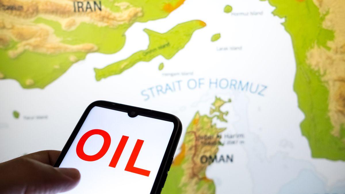The word OIL appears on a smartphone screen, and a map shows the Strait of Hormuz on a laptop computer screen in this photo illustration taken in Athens, Greece, on March 3, 2026. (Photo by Nikolas Kokovlis/NurPhoto via Getty Images)