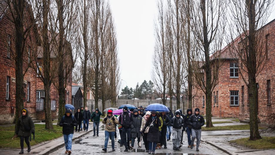 Visitors at the former Nazi German Auschwitz I concentration camp at Memorial and Museum Auschwitz-Birkenau during the 79th Anniversary Of Auschwitz-Birkenau Liberation and Holocaust Remembrance Day in Oswiecim, Poland on January 27, 2024. (Photo by Beata Zawrzel/NurPhoto via Getty Images)