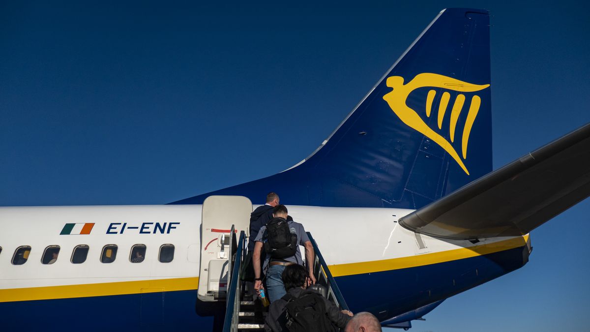 Passengers waiting in line and boarding a Ryanair low cost airline airplane at London Stansted Airport in the UK. The Boeing 737-800 passenger aircraft of the budget carrier has the registration tail number EI-ENF. Ryanair is an Irish Ultra Low-cost carrier group with headquarters in Dublin, Ireland with a fleet of 607 planes. Stansted Airport is the tertiary international airport serving London, the capital of England and the United Kingdom, fourth busiest in the UK owned by Manchester Airports Group. Stansted, United Kingdom on October 11, 2024 (Photo by Nicolas Economou/NurPhoto via Getty Images)
