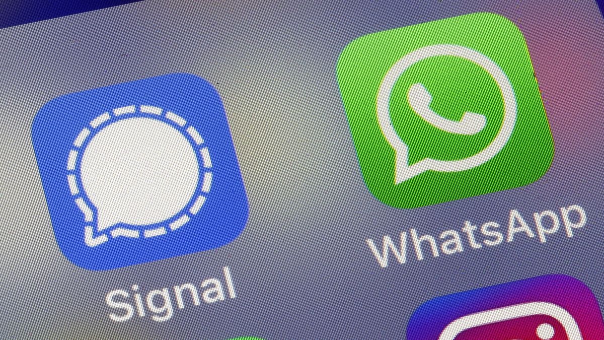 PARIS, FRANCE - JANUARY 11: In this photo illustration, the logos of social media applications, Facebook, Signal and WhatsApp are displayed on the screen of an iPhone on January 11, 2021 in Paris, France. In recent days, many WhatsApp users have migrated to Signal following the modification of WhatsApp's terms of use concerning personal data. WhatsApp has come under fire since Thursday after asking its nearly two billion users to agree to new terms of service, allowing it to share more data with its parent company Facebook. As a result, the Signal messaging application is experiencing a very strong increase in its subscriptions to the point of undergoing saturation phases. (Photo illustration by Chesnot/Getty Images)