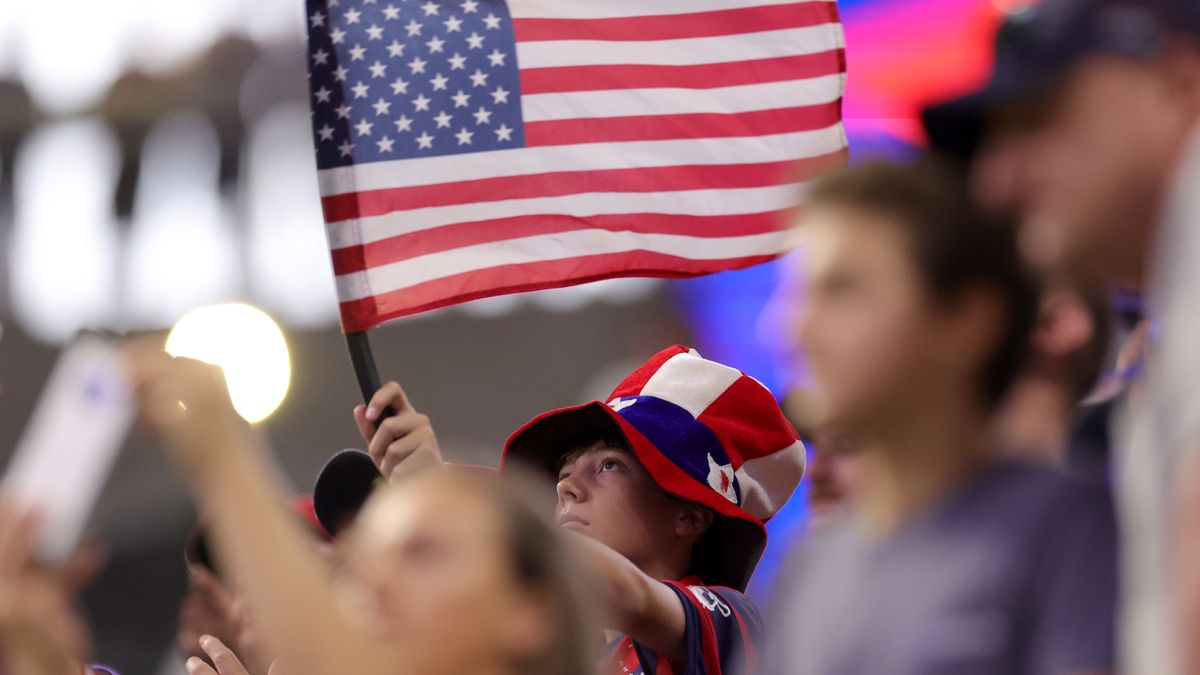 ATLANTA, GEORGIA - JUNE 27: A United States fan waves an American flag prior to the United States playing Panama at Mercedes-Benz Stadium on June 27, 2024 in Atlanta, Georgia. (Photo by Carmen Mandato/USSF/Getty Images for USSF)