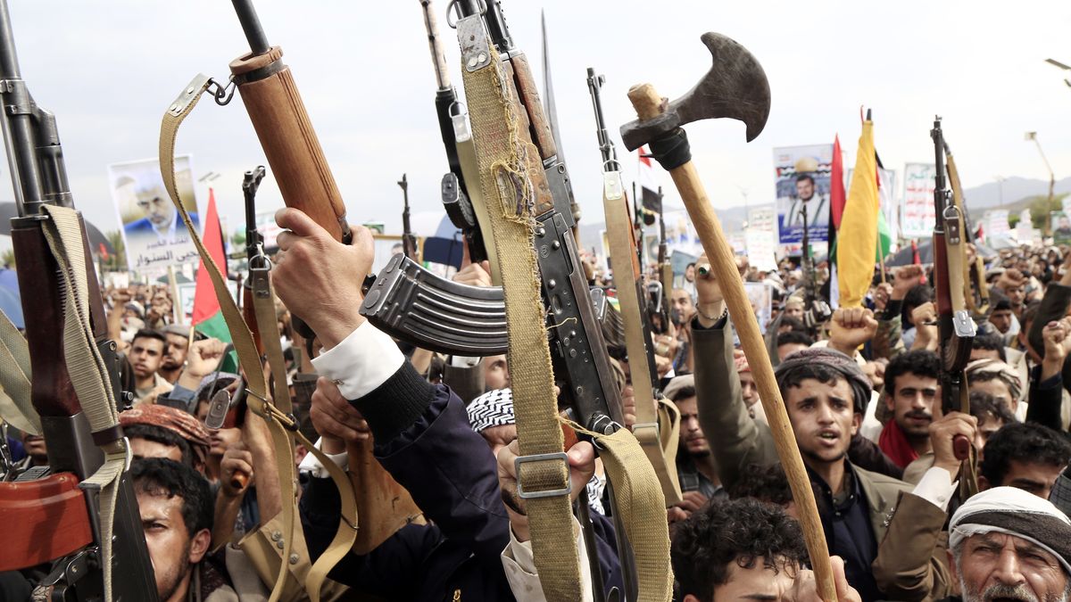 SANA'A, YEMEN - AUGUST 9: Yemenis brandish rifles, flags of Yemen and Palestine, and Houthi emblems, placards depicting Ismail Hanyah and Yahya Al-Sinwar and chant slogans as they participate in a demonstration staged in solidarity with the Palestinian people on August 9, 2024, in Sana'a, Yemen. Thousands of Yemenis loyal to the Houthi group keep participating in a demonstration staged to show solidarity with the Palestinian people and congratulate Yahya Al-Sinwar, for being named recently as a head of Hamas. (Photo by Mohammed Hamoud/Getty Images)