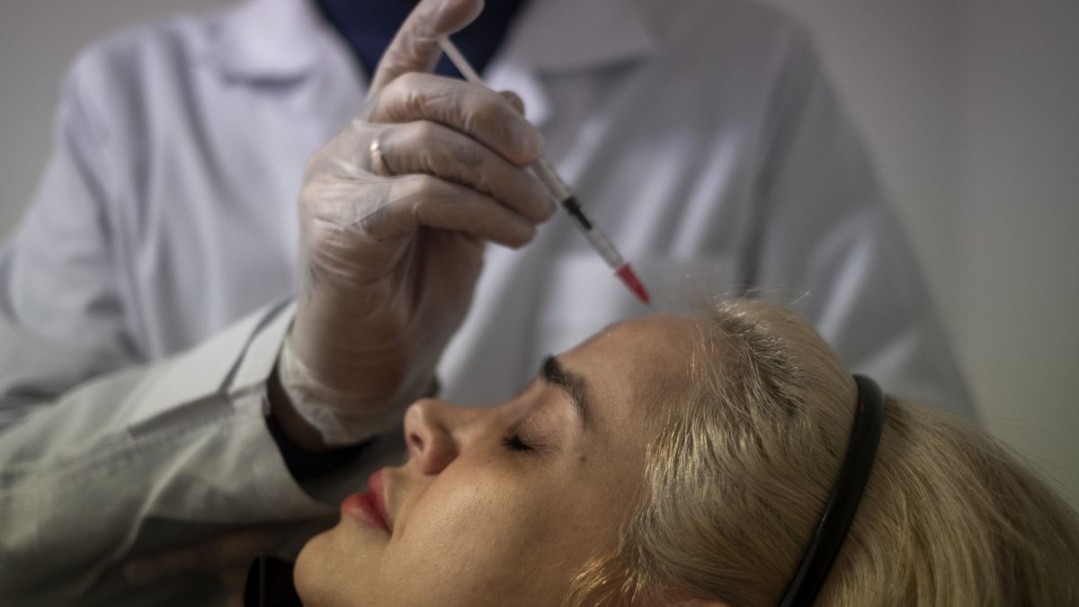 Jelveye Mandegar Specialized Skin And Hair Clinic
An Iranian doctor performs Botox injections for a woman at the Jelveye Mandegar specialized skin and hair clinic in downtown Tehran, Iran, on January 22, 2025. Ancient Iranian civilizations value skin and hair care, utilizing medicinal plants and traditional methods. Although the advent of Islam influences some customs, the use of natural materials persists. Recently, social media and lifestyle changes increase awareness and popularity of beauty and personal care, even among men in Iran. The rising dollar value makes cosmetic services cheaper for foreigners, and Iran becomes a hub for cosmetic surgery and skin care, bolstered by specialized personnel and advanced technologies, which also contributes to the growth of health tourism in the country. (Photo by Morteza Nikoubazl/NurPhoto via Getty Images)
NurPhoto
iranian-people, islamic-countries, persian-gulf, thrapy, skin-and-hair-care, youths, lifestyle, male-cosmetic-technician, jelveye-mandegar-specialized-skin-and-hair-clinic, lip-fillers, middle-eastern-countries, science-and-technology, beauty-care, cosmetic-surgery, middle-east, eyebrow-transplantation, cosmetic-and-women, hair-roots, botox-injections, iranian-youths, cosmetic-and-men, cosmetic, advanced-technologies, iranian-men, cosmetic-services, muslim-people, health-tourism, rising-dollar-value, cosmetic-technology, popularity-of-beauty-and-personal-care, female-cosmetic-technician, skin-repair, persian-gulf-countries, middle-east-and-beauty, hub-for-cosmetic-surgery-and-skin-care, iranian-women, skin-laser-treatment, social-media, cosmetic-care