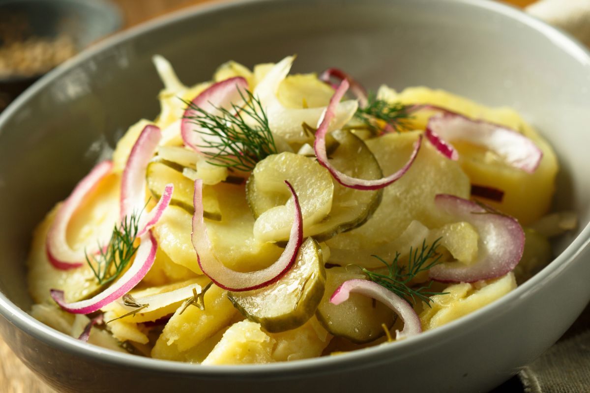 Grilled salad with pickled cucumbers and onion