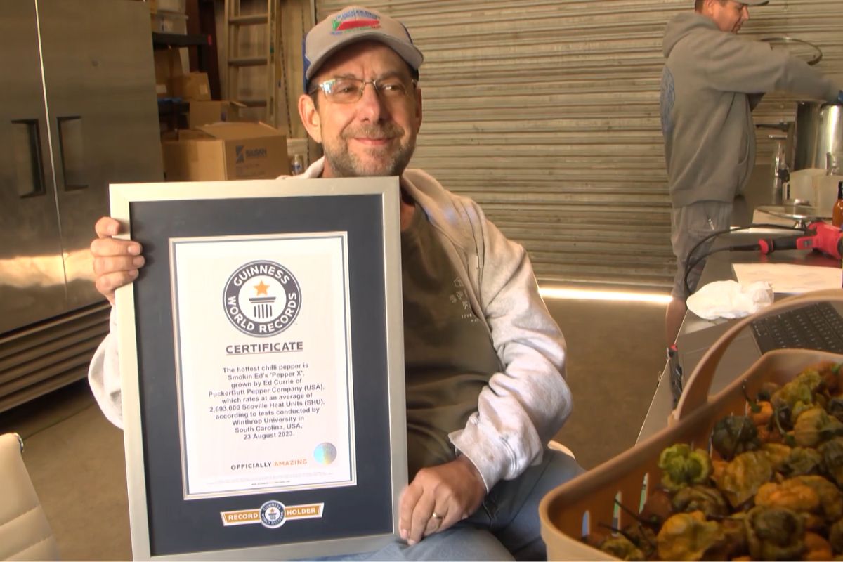 Ed Currie, the inventor of Pepper X, with a certificate from the Guinness Book of Records.