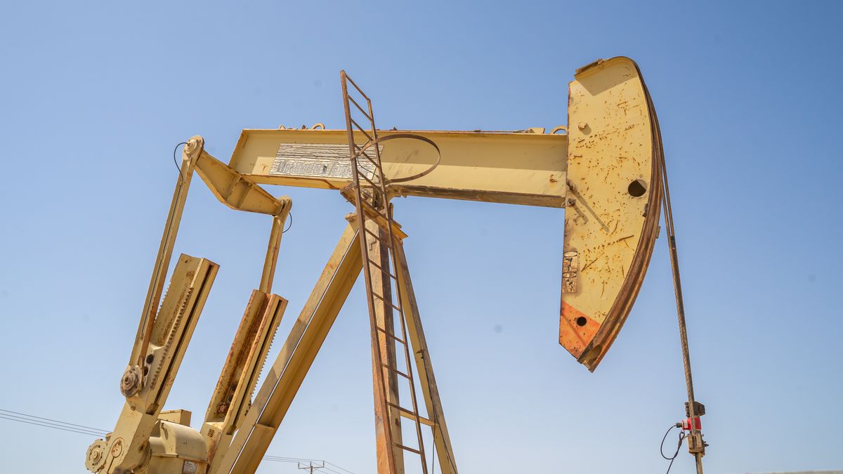 Pump jack, oil horse, oil jack, beam pump extracting crude oil from oil well in the Bahrain desert. (Photo by: ruelleruelle/UCG/Universal Images Group via Getty Images)