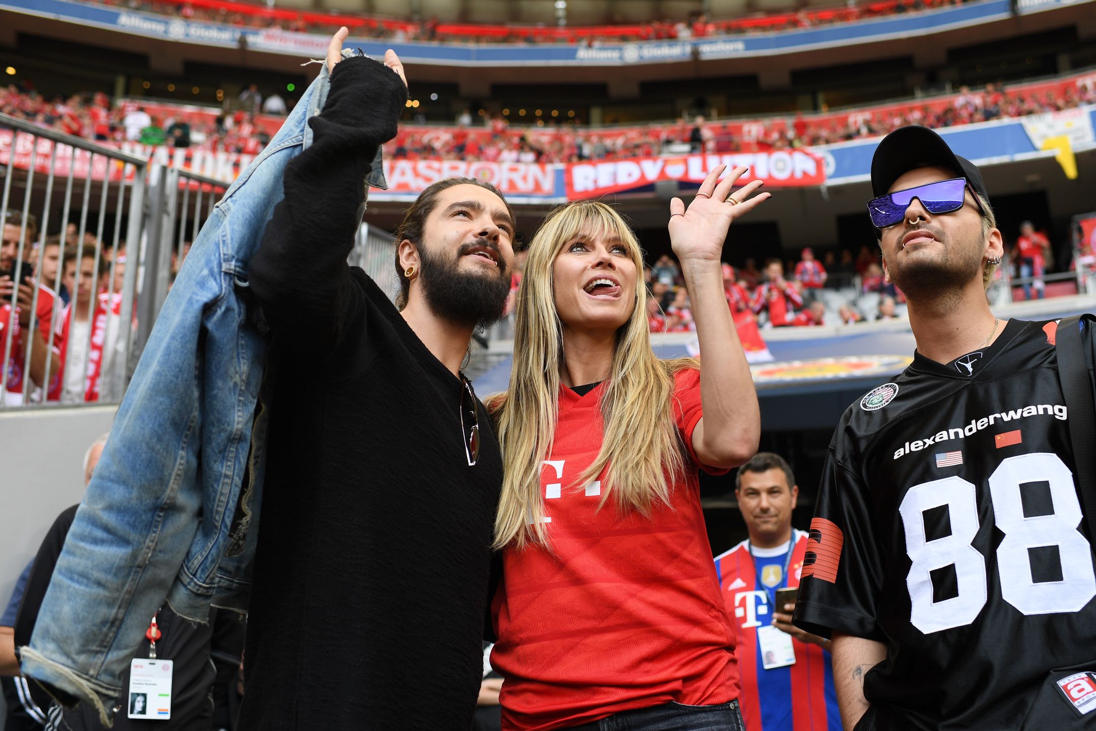 MUNICH, GERMANY - MAY 18: (EDITORS NOTE: Image has been digitally enhanced.)  Model Heid Klum, her fiance Tom Kaultiz (L) and his brother Bill Kaulitz look on prior to to the Bundesliga match between FC Bayern München and Eintracht Frankfurt at Allianz Arena on May 18, 2019 in Munich, Germany. (Photo by Matthias Hangst/Bundesliga/DFL via Getty Images)
