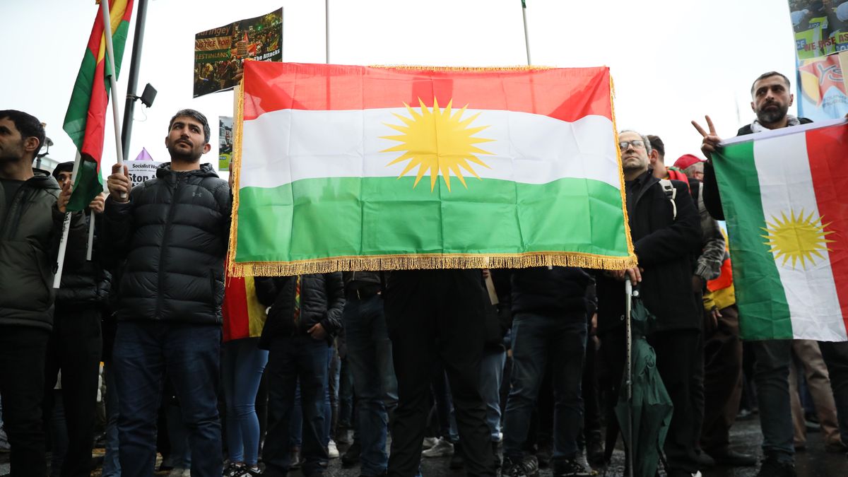 LONDON, ENGLAND - DECEMBER 1: A member of the Kurdish community holds a flag of Kurdistan during a protest near Trafalgar Square on December 1, 2024 in London, United Kingdom. Earlier this week, counter-terrorism police arrested seven people from a search of eight addresses, including the Kurdish Community Centre in Haringey, North London, as part of an investigation into the Kurdistan Workers Party. Known as the PKK, the group is a proscribed terrorist organization in the UK and has been banned since March 2001. (Photo by Alishia Abodunde/Getty Images)