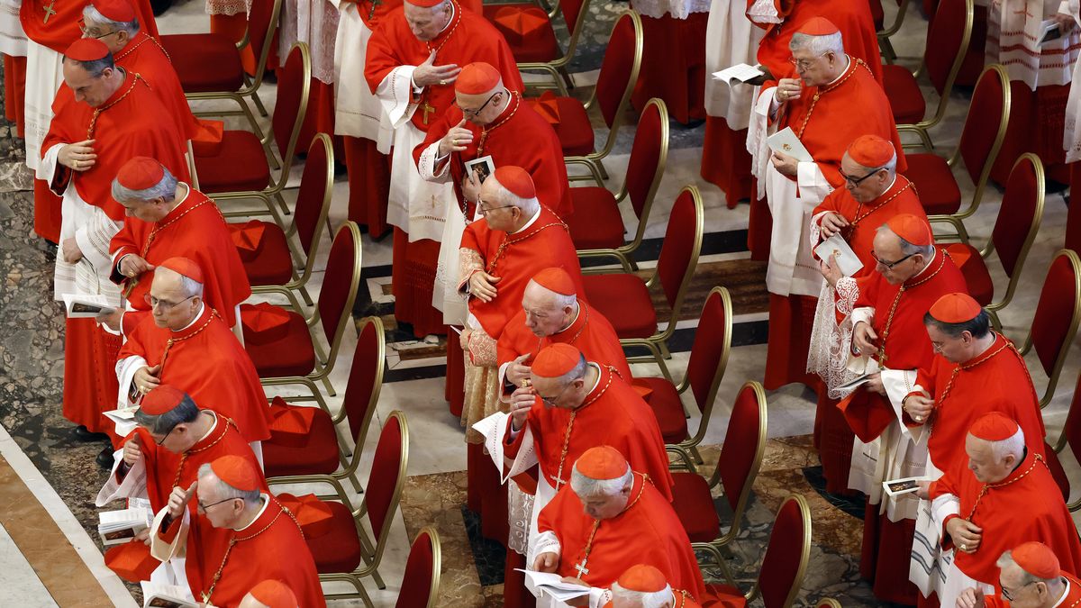 VATICAN CITY, VATICAN - APRIL 23: Cardinals look on as the body of Pope Francis is transferred into the Basilica at St Peter’s Square on April 23, 2025 in Vatican City, Vatican. On the third day since the death of Pope Francis was announced by the Vatican, his body is transferred from the Chapel of Santa Marta to the Basilica St Peter. He will lie in state in a simple wooden coffin until his funeral, which will be held on Saturday, 26th April 2025.  (Pool photo by Mario Tama/Getty Images)