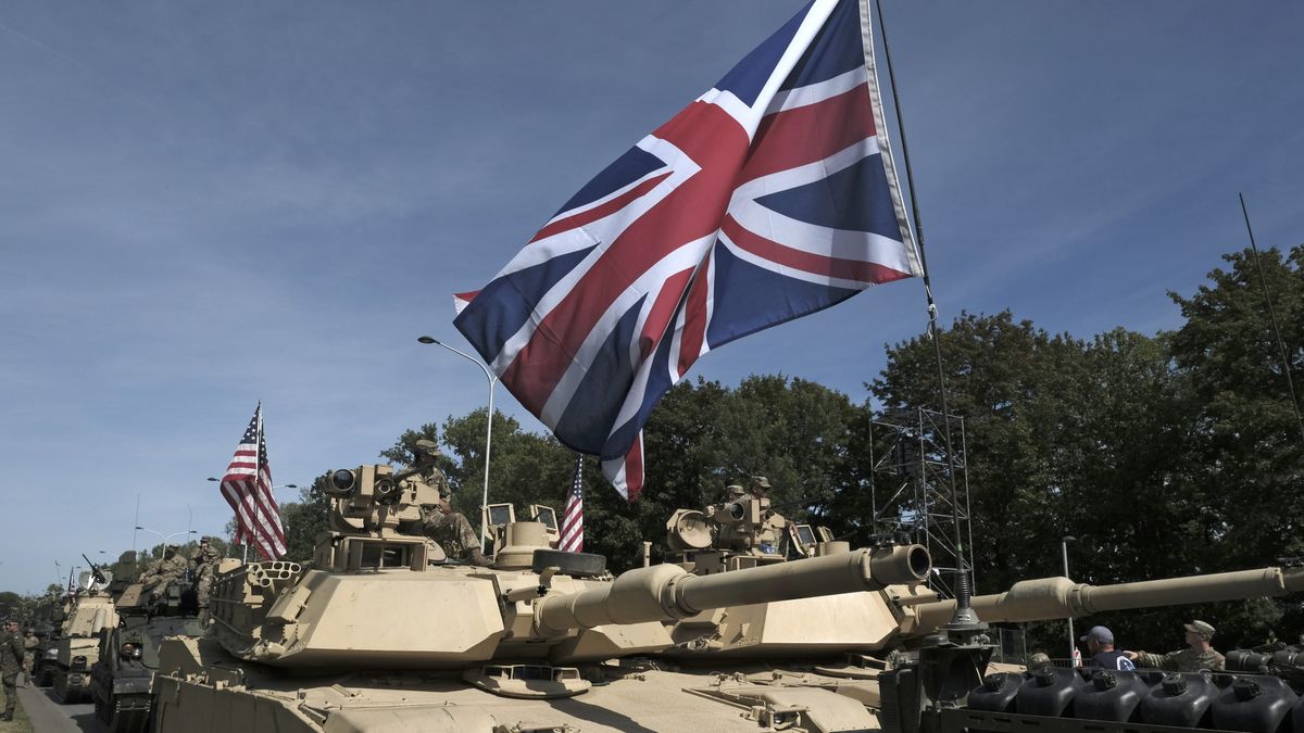 American and British flags on tanks lined up ahead of the Polish Army Day parade in Warsaw, Poland, on Thursday, Aug. 15, 2024. Poland signed a $10 billion agreement to purchase almost a hundred AH-64E Apache attack helicopters from US manufacturer Boeing Co., as Warsaw ramps up its defensive capabilities. Photographer: Damian Lemanski/Bloomberg via Getty Images