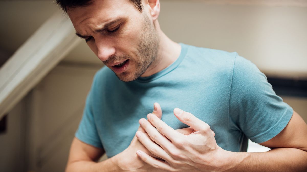 Ill man holding his chest
Young man having strange chest pain
RgStudio