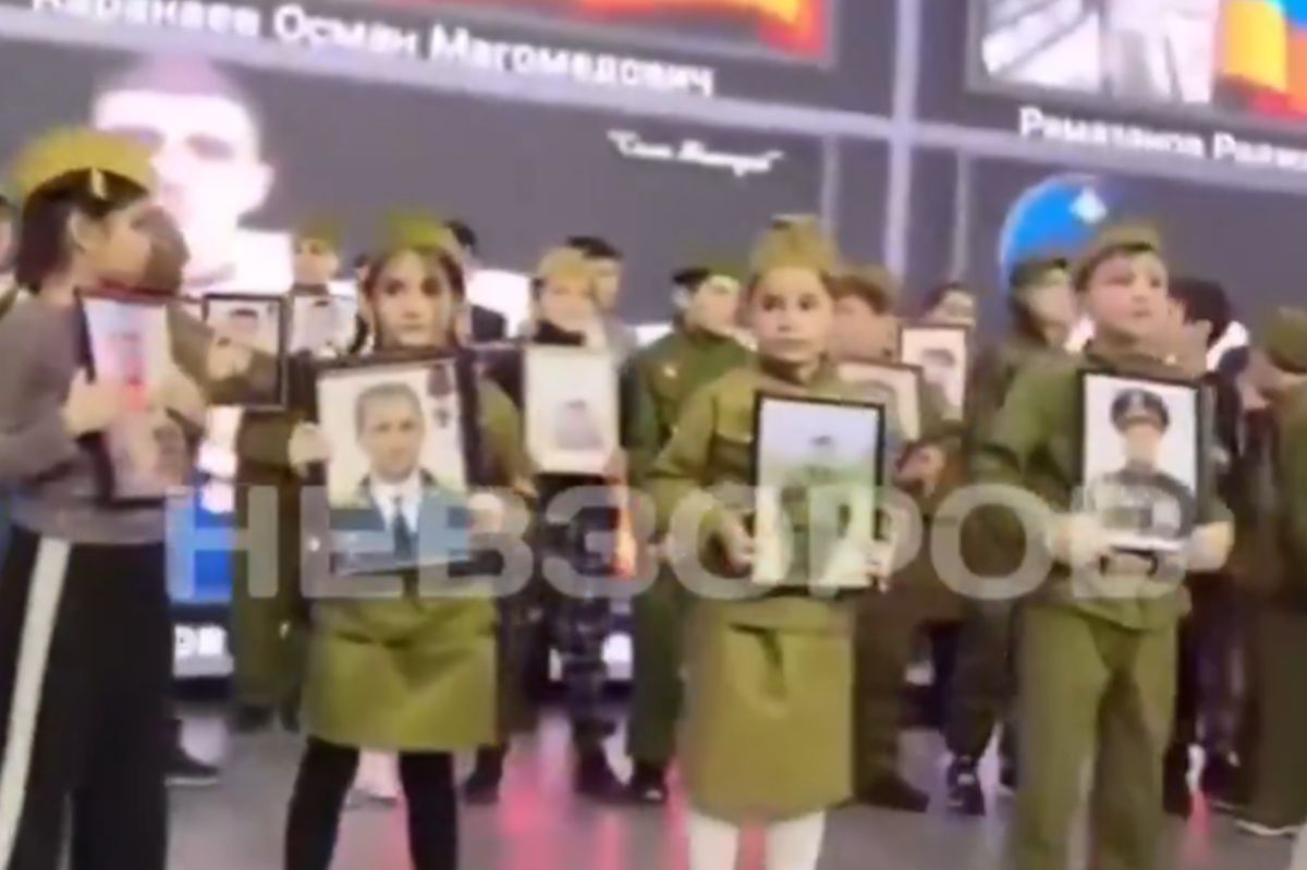Russian children with portraits of soldiers. Among them, there are no shortage of murderers and criminals.