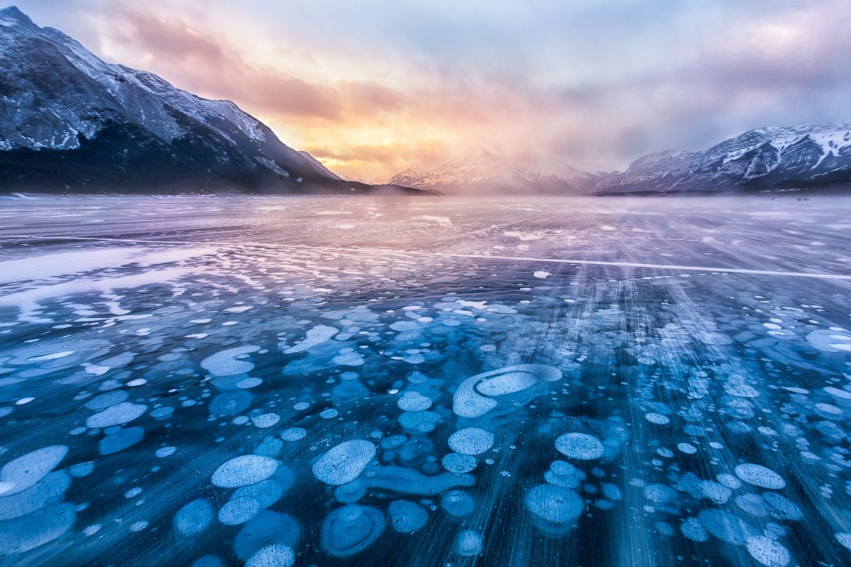 Canada's Abraham Lake, a captivating yet perilous spectacle of methane bubbles under ice