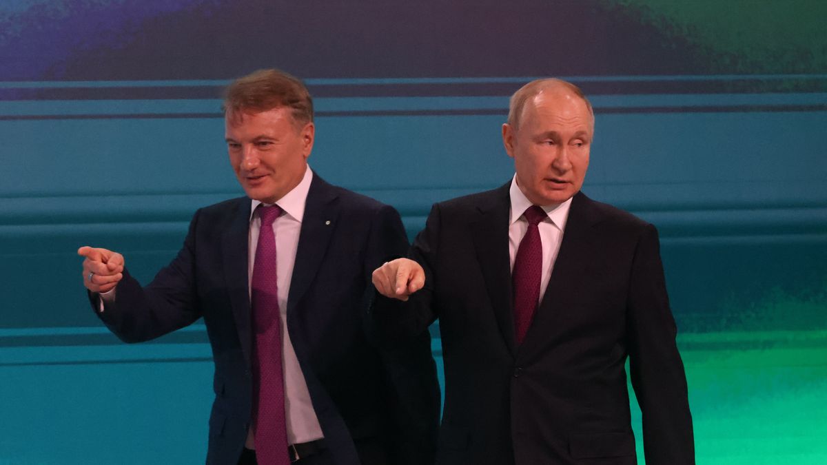 MOSCOW, RUSSIA - NOVEMBER 24 (RUSSIA OUT) Russian President Vladimir Putin (R) and Sberbank President Herman Gref (L) point during the AIJ 2022 (Artifical Intelligence Journey) Conference, November,24,2022, in Moscow, Russia. President Putin delivered a speech at the conference, hosted by Sberbank, whose SWIFT was blocked by Western sanctions due to the Russian military invasion on Ukraine. (Photo by Contributor/Getty Images)
