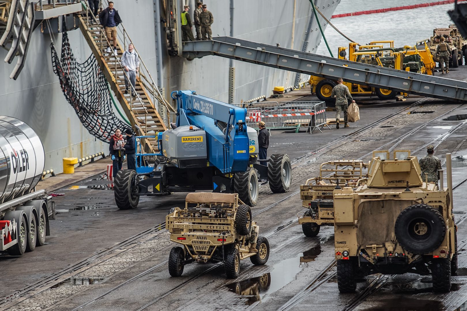 US Marines corp soldiers in front of Wasp-class amphibious assault ship of the United States Navy USS Kearsarge are seen in Gdynia, Poland on 17 September 2022 The ship visits Gdynia to replenish supplies. The increased presence of American warships in the Baltic Sea is related to Russia's war against Ukraine (Photo by Michal Fludra/NurPhoto via Getty Images)