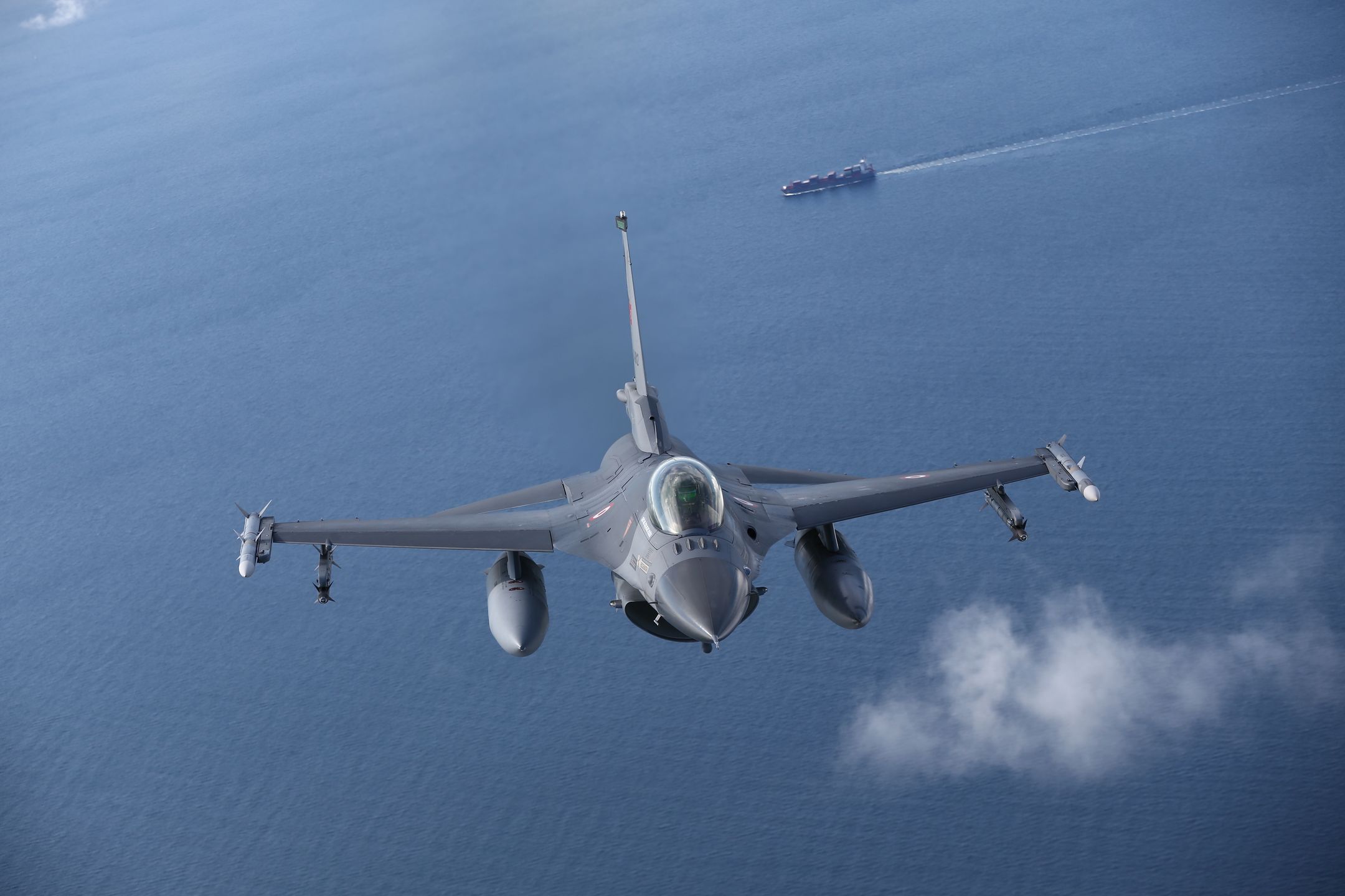MALBORK, POLAND - AUGUST 27: Turkish F-16 fighter jet pilots fly by C-295M Casa military cargo plane of Poland as F-16 fighter jets of Turkish Air Forces serve in NATO's "Air Policing" mission at 22nd Air Base Command in Malbork, Poland on August 27, 2021. (Photo by Cuneyt Karadag/Anadolu Agency via Getty Images)