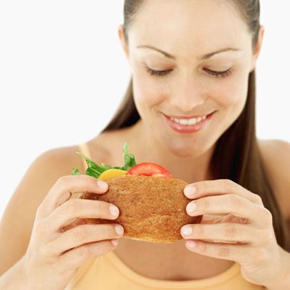 woman-eating-sandwich-photo-420x420-ts-57305981