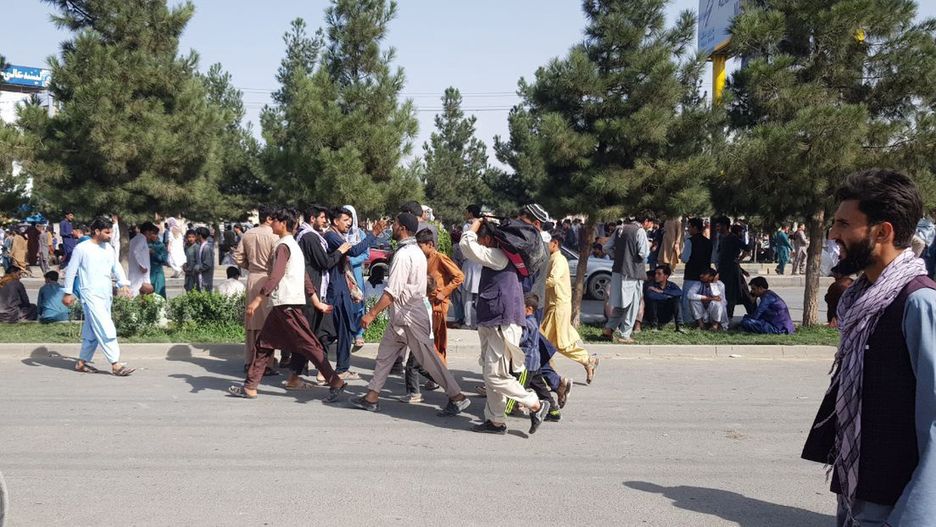 KABUL, AFGHANISTAN - AUGUST 16: Afghans crowd at the Kabul airport on August 16, 2021, to flee the country as the Taliban were in control of Afghanistan after President Ashraf Ghani fled the country. (Photo by Sayed Khodaiberdi Sadat/Anadolu Agency via Getty Images)