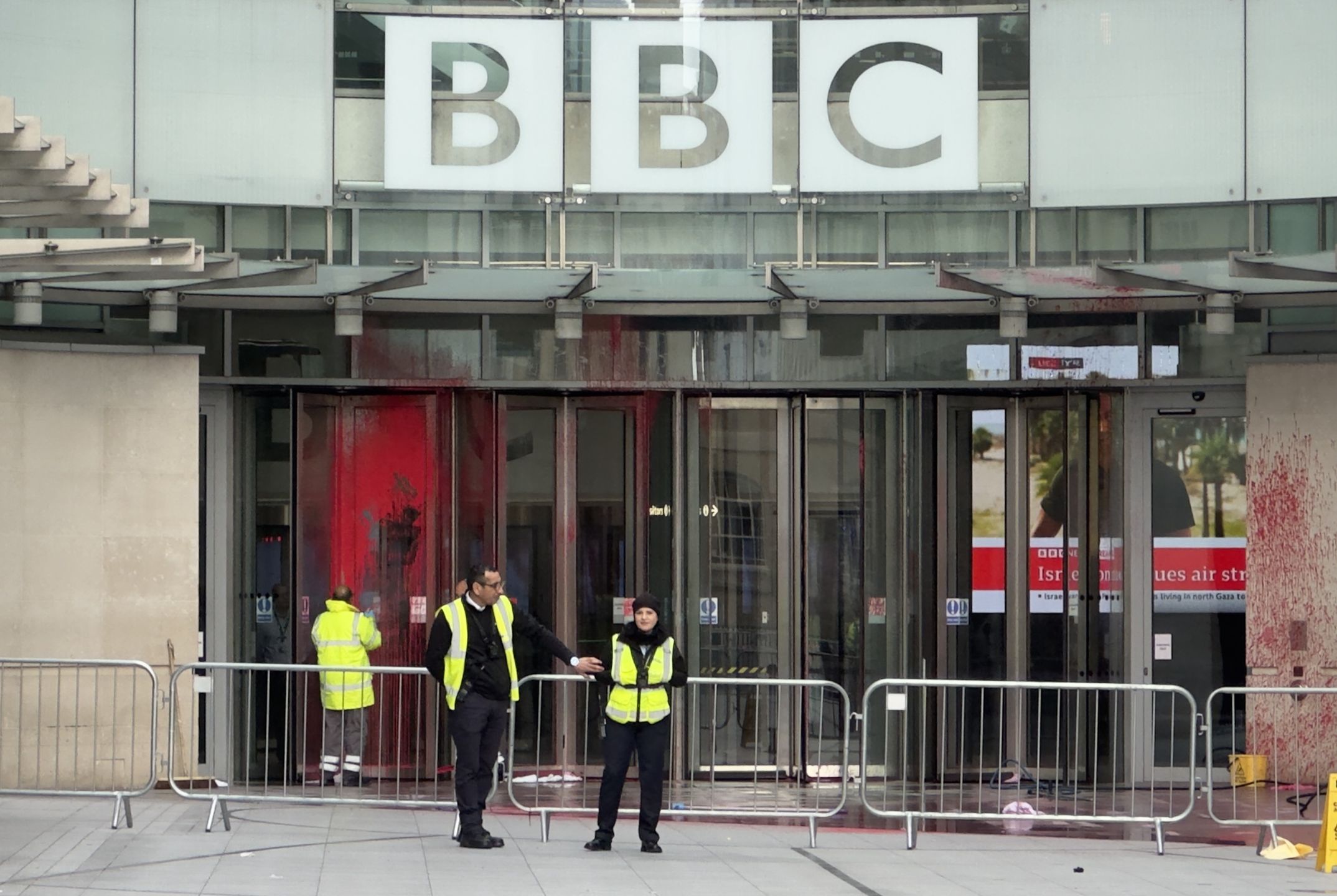 LONDON, ENGLAND - OCTOBER 14: Security forces stand guard as red paint is seen at the entrance to the BBC building in London while supporters of Palestine stage a protest to condemn the Israeli airstrikes in Gaza on October 14, 2023 in London, United Kingdom. (Photo by Muhammed Yaylali/Anadolu via Getty Images)