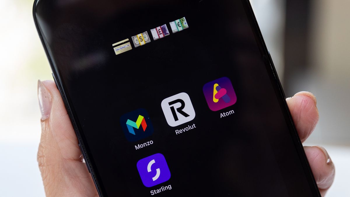 The Revolut Ltd. app icon, along with Monzo Bank Ltd., Starling Banking Ltd. and Atom Bank Plc app icons, on a smartphone arranged in London, UK, on Friday, July 26, 2024. Revolut said it received a British banking license from regulators, a move that allows the fintech firm to better challenge traditional banking giants. Photographer: Betty Laura Zapata/Bloomberg via Getty Images