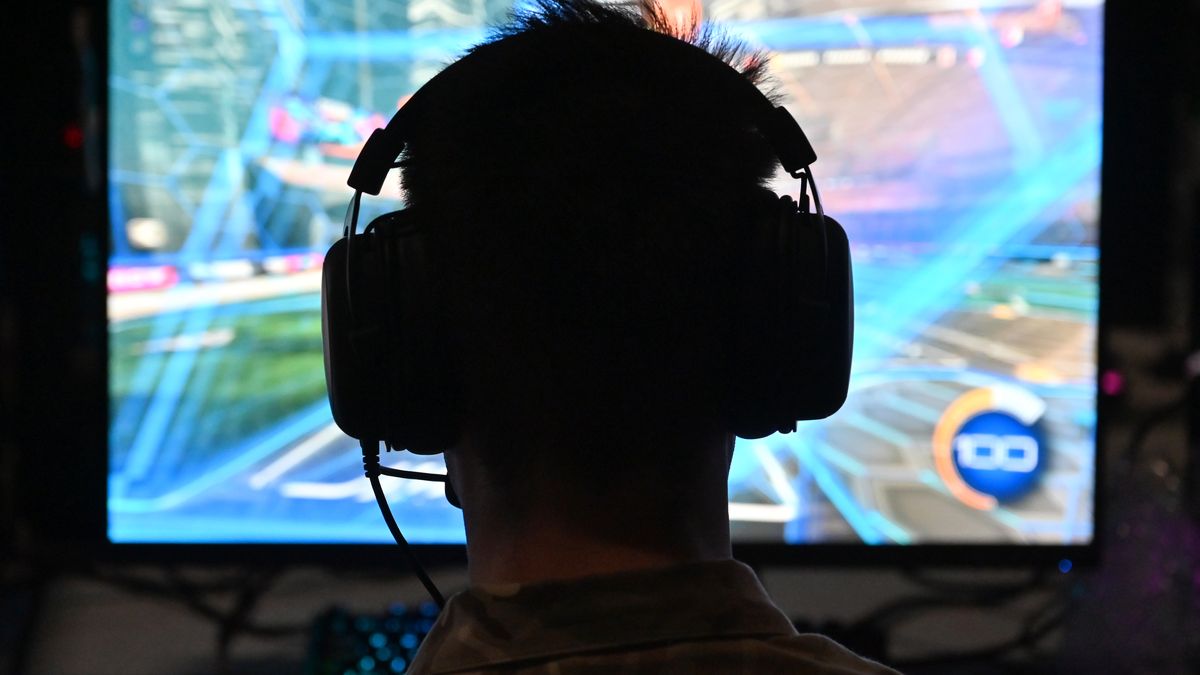 BIRMINGHAM, ENGLAND - SEPTEMBER 08: A gamer wears earphones as they play video games on their own Computers at the UK's biggest LAN party during the Insomnia Gaming Festival #I71 at NEC Arena on September 08, 2023 in Birmingham, England. Insomnia is the ultimate gaming experience festival of non-stop gaming, with everything from the latest video games to retro classics, tournaments with prizes and with meet-and-greets with creators. (Photo by John Keeble/Getty Images)