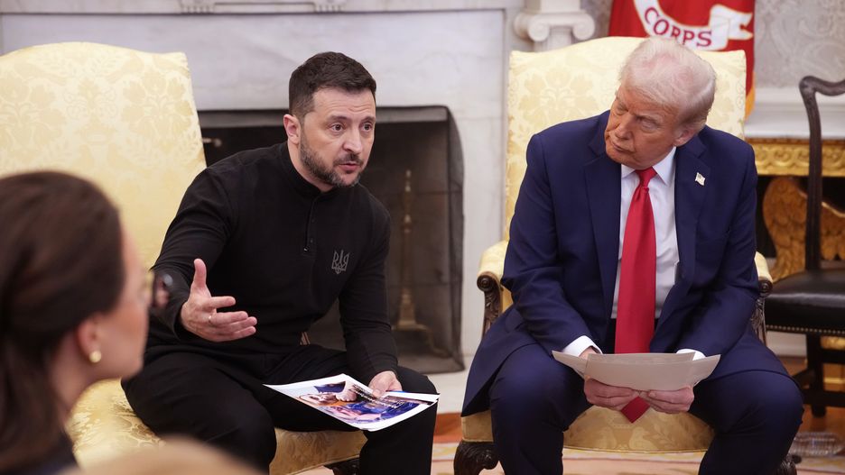 WASHINGTON, DC - FEBRUARY 28: Ukrainian president Volodymyr Zelensky holds photos of Ukrainians who were captures by Russian troops as he meets with U.S. President Donald Trump in the Oval Office at the White House on February 28, 2025 in Washington, DC. Trump and Zelensky are meeting today to sign a preliminary agreement on sharing Ukraine’s mineral resources that Trump says will allow America to recoup aid provided to Kyiv while supporting Ukraine’s economy. (Photo by Andrew Harnik/Getty Images)