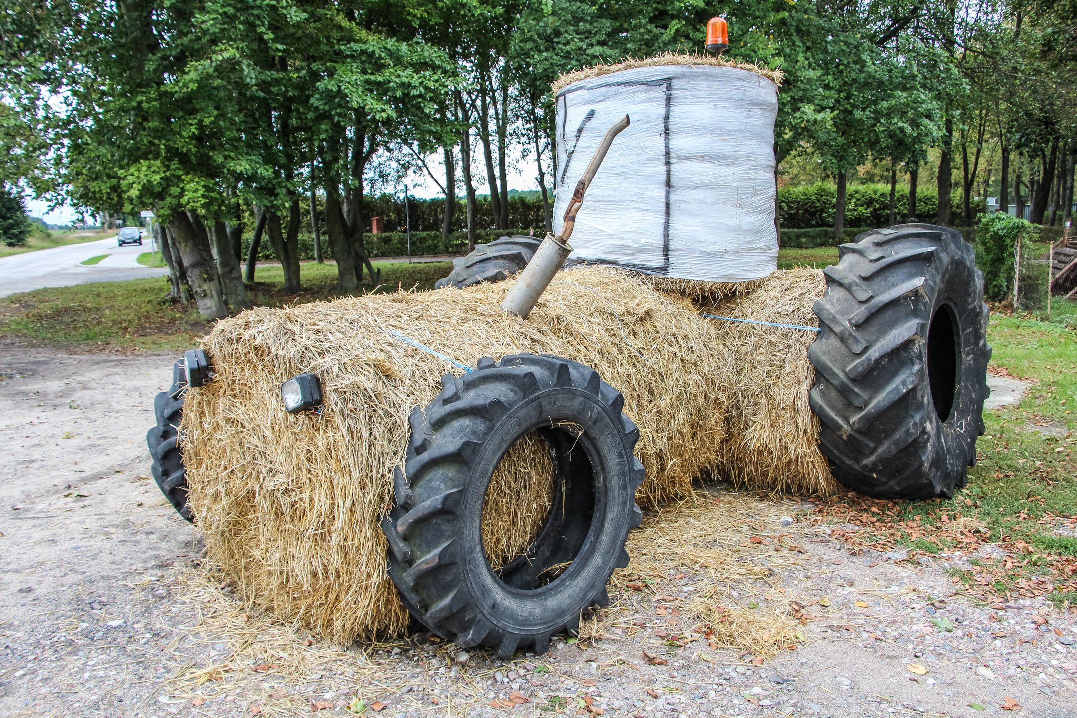 Straw installation in the shape of a big tractor made in occasion of Harvest Festival is seen in Zamarte, Poland, on 12 September 2019 Harvest festival (pol. Dozynki) is a Slavic harvest festival, it's usually celebrated on one of the Sundays following the end of the harvest season,to thank the reapers and their families for their work, both during the harvest and during the past year. (Photo by Michal Fludra/NurPhoto via Getty Images)