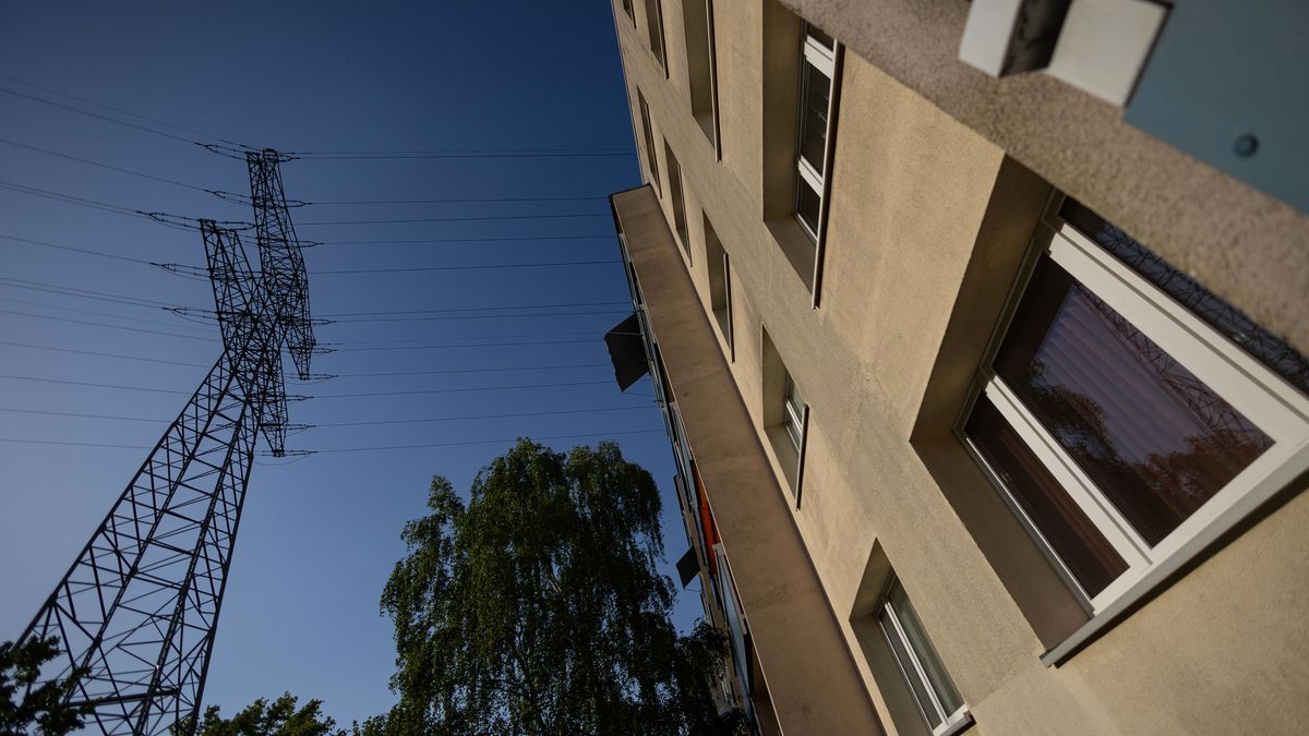 An electricity transmission pylon next to a block of residential apartments in Berlin, Germany, on Tuesday, April 30, 2024. Power prices in Europe swung in a 260 ($279) per megawatt-hour range at the weekend, almost triple the past year's daily average, as a strong supply of wind dropped. Photographer: Krisztian Bocsi/Bloomberg via Getty Images