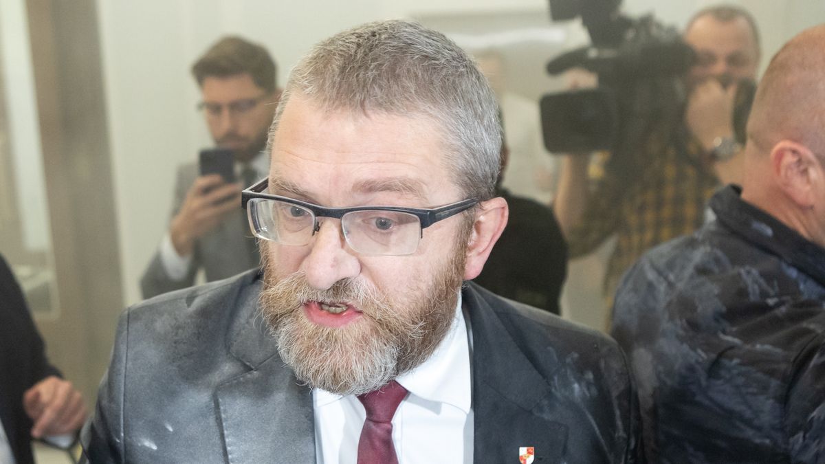 Grzegorz Braun, a far-right Polish lawmaker, is using a fire extinguisher on Hanukkah candles in parliament in Warsaw, Poland, on December 12, 2023. (Photo by Foto Olimpik/NurPhoto via Getty Images)