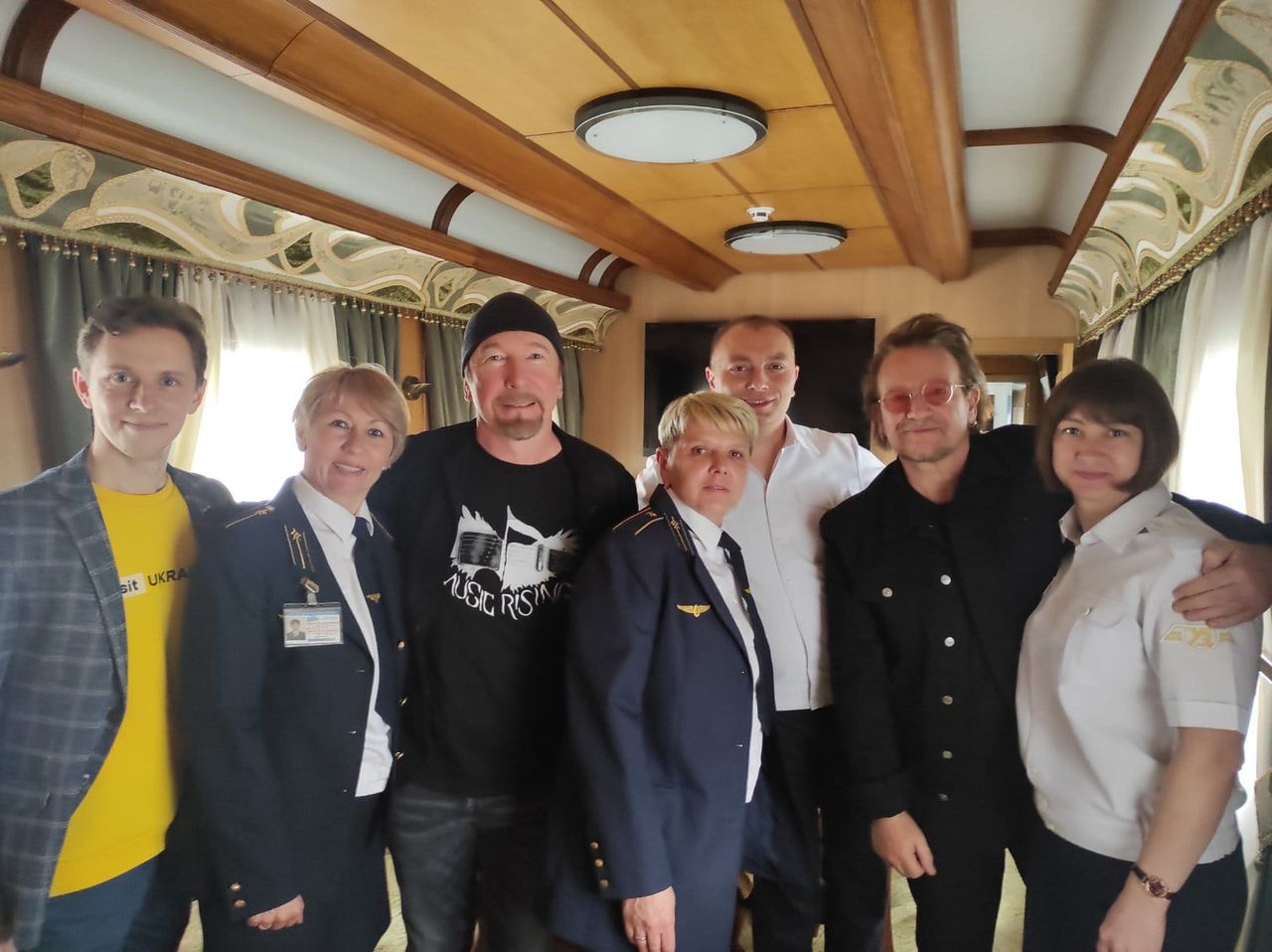 The crew of the Ukrainian Railways with the lead singer of U2 - Bono