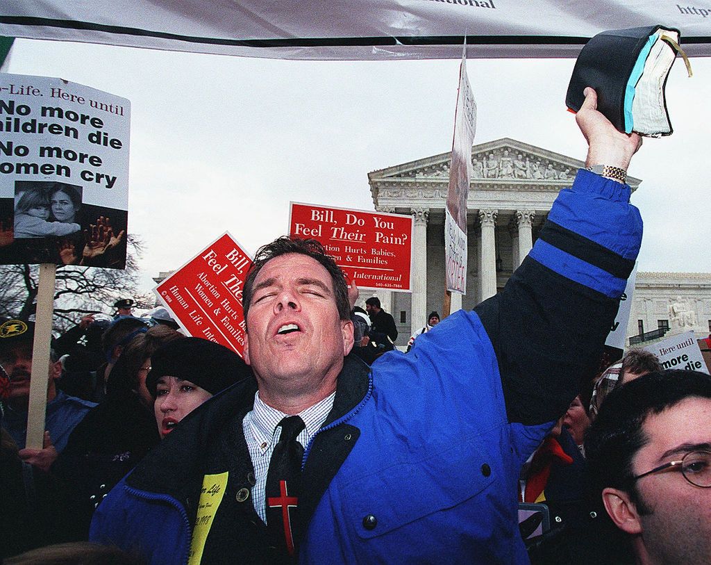 ROE V. WADE 25TH ANNIVERSARY--On the 25th anniversary of RoeUNITED STATES - JANUARY 22:  ROE V. WADE 25TH ANNIVERSARY--On the 25th anniversary of Roe v. Wade, the case which established the legal right to abortion, Rev. Flip Benham, executive director of Operation Rescue National in Dallas, Texas, worships in front of the U.S. Supreme Court.  (Photo by Scott J. Ferrell/Congressional Quarterly/Getty Images)Scott J. FerrellRoe V. Wade 25th Anniversary, Abortion, Rev. Flip Benham, Operation Rescue, U.s. Supreme Court