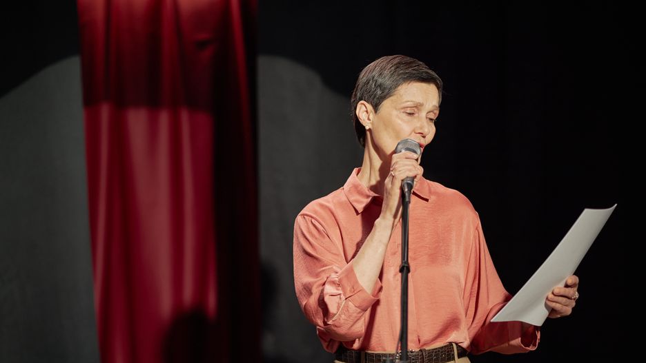 Middle Aged Caucasian Woman Performing Spoken Word on Stage during Talent Competition
Middle aged Caucasian woman standing on stage holding microphone and reading from paper during talent competition, focused expression, short hair, stage curtain in background
talent competition, stage, performance, microphone, public speaking, recite, read, presentation, speech, entertainment, audition, spotlight, curtain, event, female, woman, middle aged, caucasian, adult, solo, expression, focus, concentration, art, creativity, literature, poetry, reading, showcase, competition, performer, individual, indoor, culture, voice, music, sing, act, entertainer, live, audience, theater, creative, talent competition, stage, performance, microphone, public speaking, recite, read, presentation, speech, entertainment, audition, spotlight, curtain, event, female, woman, middle aged, caucasian, adult, solo, expression, focus, concentration, art, creativity, literature, poetry, reading, showcase, competition, performer, individual, indoor, culture, voice, music, sing, act, entertainer, live, audience, theater, creative