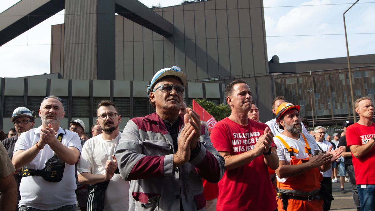 A thousand steel workers stand in front of the gate of the Thyssenkrupp industrial area in Duisburg, Germany, on August 29, 2024, as the IG Metall union calls for a strike due to the new ownership taking over the German steel maker Thyssenkrupp, which faces massive job cuts. (Photo by Ying Tang/NurPhoto via Getty Images)