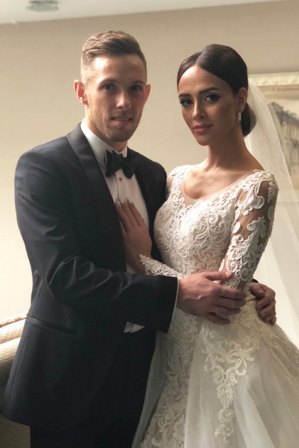 Maciej Rybus z żoną