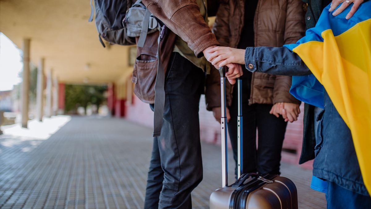 Low section of Ukrainian refugee family in station waiting to leave Ukraine due to the Russian invasion of Ukraine.
Ukrainian refugee family waiting for train in station, Ukrainian war concept.
Halfpoint Images
