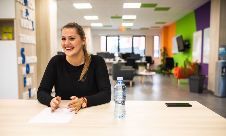 A young woman glowing in a job interviewA young woman is in a job interview in an officeAleksandar  Jankovic