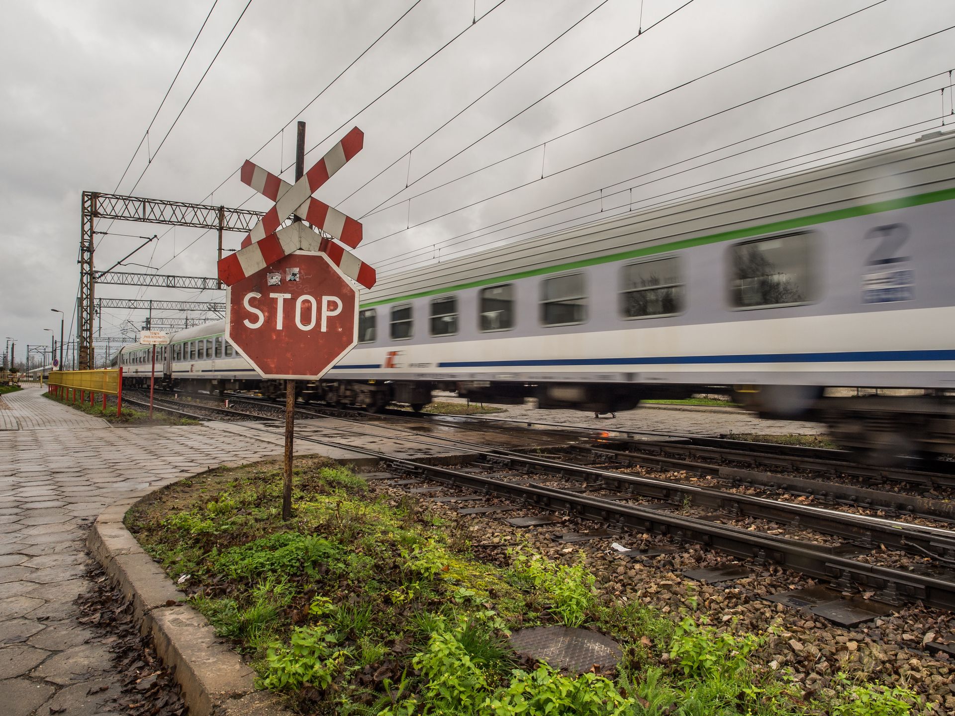 Train inside depot
Warsaw, Poland - October 20, 2017: Moving passenger trains at the railway depot in Olszynka Grochowska and red STOP sign with Saint Andrew's Cross
Mirek Nowaczyk
Poland, Polish, STOP sign, Warsaw, carriage, course, europe, european, grade crossing, grail, industrial, industry, intersection, level crossing, line, move, moving, passenger, patch, path, rail, railroad tracks, railway, remedy, repair, road, road crossin, road sign, road through, rolling-stock, safety, saint andrew's cross, saltire, saltire sign, shunt, sidetrack, siding, sign, steering, stop, stop icon, switch, technological, track, traffic sign, train, train crossing, train stop sign, trains, transport, transportation, underground, vehicle, wagons, warning, way, stop sign, poland, polish, warsaw, carriage, course, europe, european, grade crossing, grail, industrial, industry, intersection, level crossing, line, move, moving, passenger, patch, path, rail, railroad tracks, railway, remedy, repair, road, road crossin, road sign, road through, rolling-stock, safety, saint andrew's cross, saltire, saltire sign, shunt, sidetrack, siding, sign, steering, stop, stop icon, switch, technological, track, traffic sign, train, train crossing, train stop sign, trains, transport