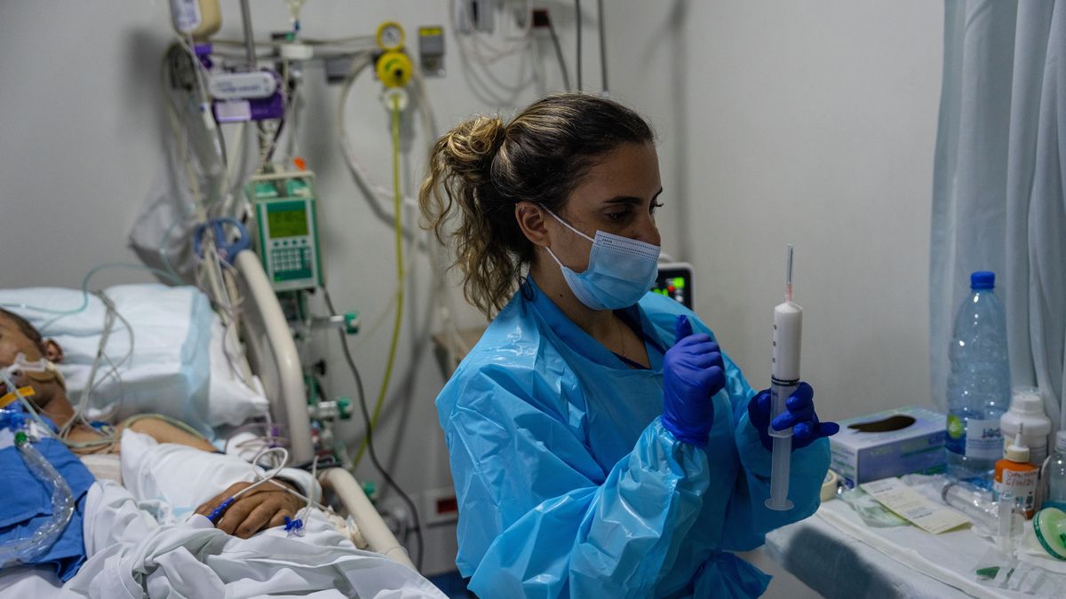 BEIRUT, LEBANON - OCTOBER 7: A nurse treats an unidentified patient, (whose face cannot be shown) who was seriously injured in an Israeli airstrike, at Geitaoui Hospital on October 7, 2024 in Beirut, Lebanon. Hundreds of thousands of people have fled Lebanon in recent weeks, as Israel has ramped up its attacks on Hezbollah, the Iran-backed militant and political group. Israel is conducting daily airstrikes in the capital and elsewhere in the country, while expanding its ground operation in the south. (Photo by Carl Court/Getty Images)