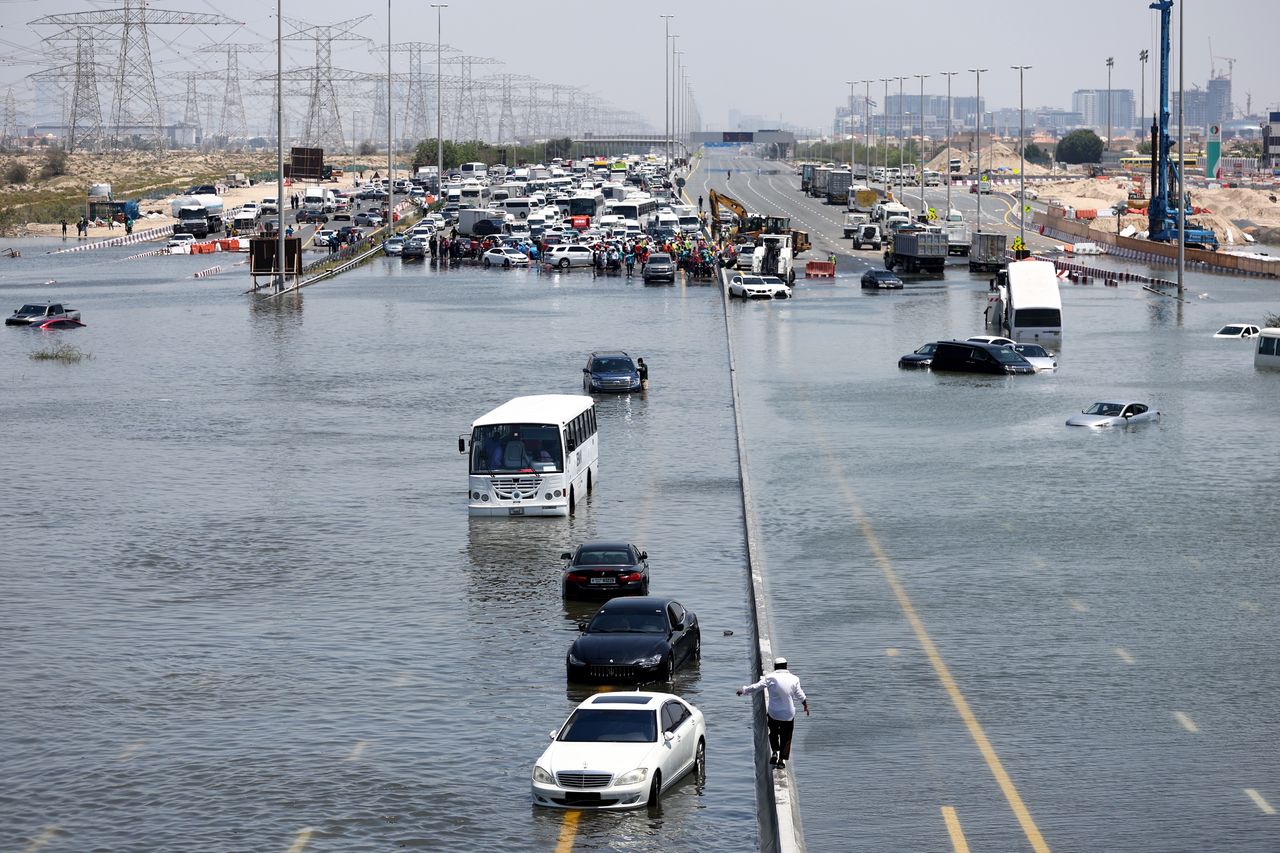 DUBAI, UNITED ARAB EMIRATES - APRIL 18:  A general view of abandoned vehicles on a flooded highway can be seen on April 18, 2024 in Dubai, United Arab Emirates. Atypically heavy rains in the UAE on Monday and Tuesday caused flooding, flight cancellations, and school closures. UAE authorities have denied that their cloud-seeding operations were to blame for the extreme rainfall. (Photo by Francois Nel/Getty Images)