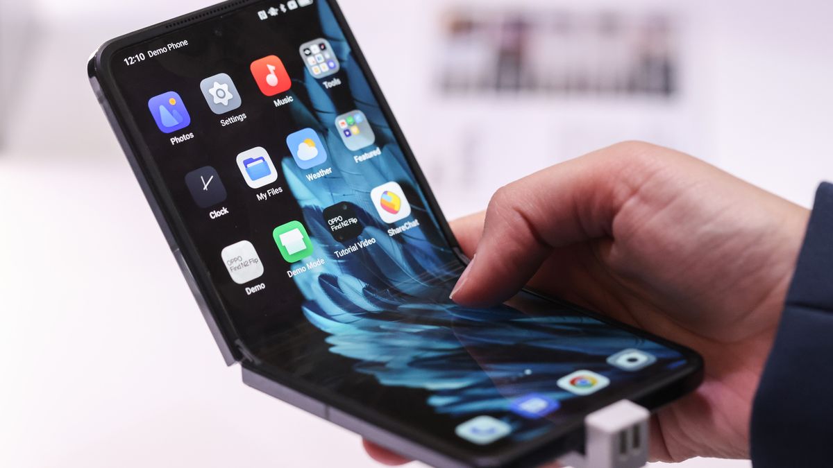 The Oppo Find N2 Flip foldable smartphone at the the Guangdong Oppo Electronics Co. stand on day two of the Mobile World Congress at the Fira de Barcelona venue in Barcelona, Spain, on Tuesday, Feb. 28, 2023. The annual flagship mobile industry and technology event runs from Feb. 27 to March 2. Photographer: Angel Garcia/Bloomberg via Getty Images