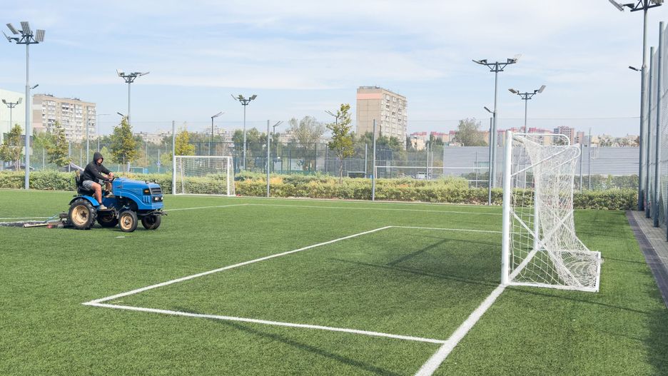 soccer field and worker in field. High quality photo
