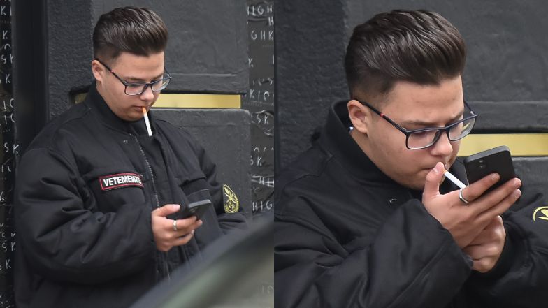 Allan Krupa pali papierosa przed butikiem