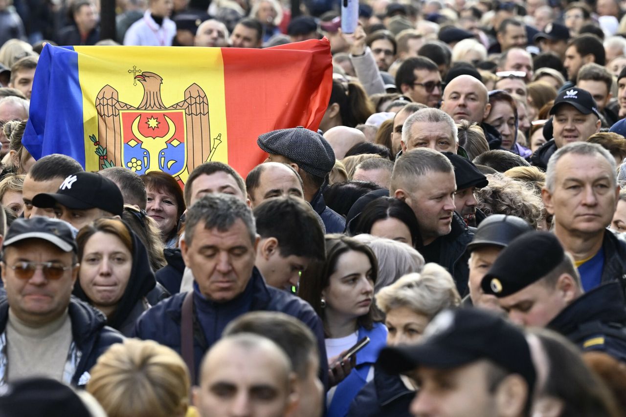 Citizens of Moldova are standing in line to vote.