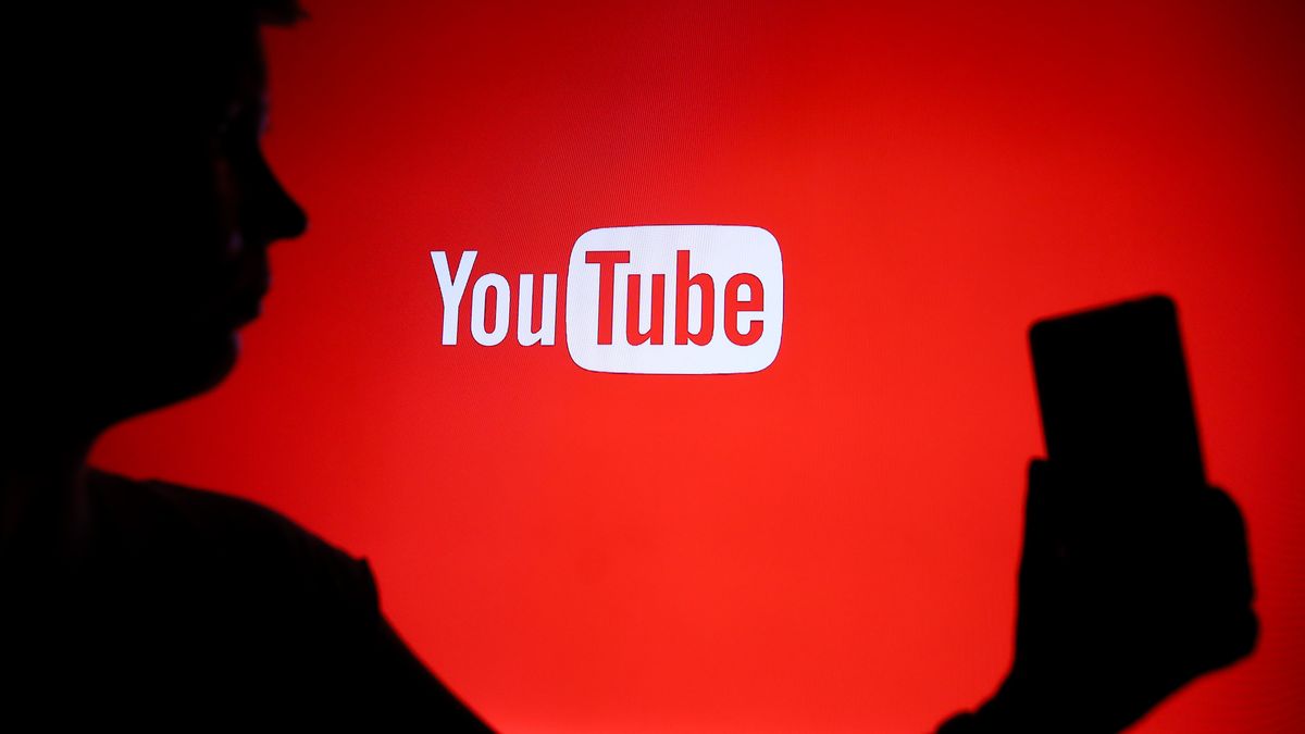 A person holds a phone displaying the YouTube logo in Knurow, Poland, on April 20, 2025. (Photo Illustration by Klaudia Radecka/NurPhoto via Getty Images)
