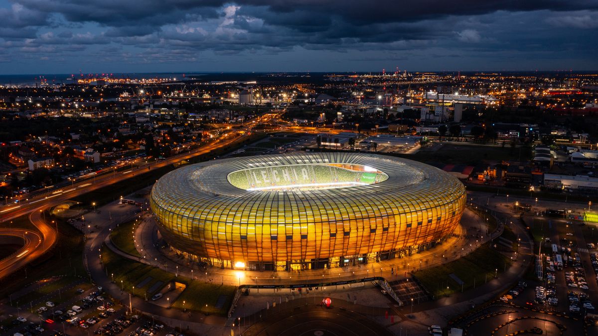 Gdansk, Poland - August 31, 2022: Aerial landscape with amber shape stadium - Polsat Plus Arena by the Baltic Sea in Gdansk at dusk, Poland.
stadium, gdansk, arena, polsat plus arena, aerial, amber, architecture, baltic, beautiful, blue, building, city, cityscape, construction, destination, drone, dusk, ekstraklasa, europe, european, exterior, facade, football, gold, highway, illuminated, landmark, landscape, league, lechia, modern, panorama, panoramic, poland, polish, road, scenery, seaside, shape, sky, soccer, sport, summer, sunset, team, tourism, travel, urban