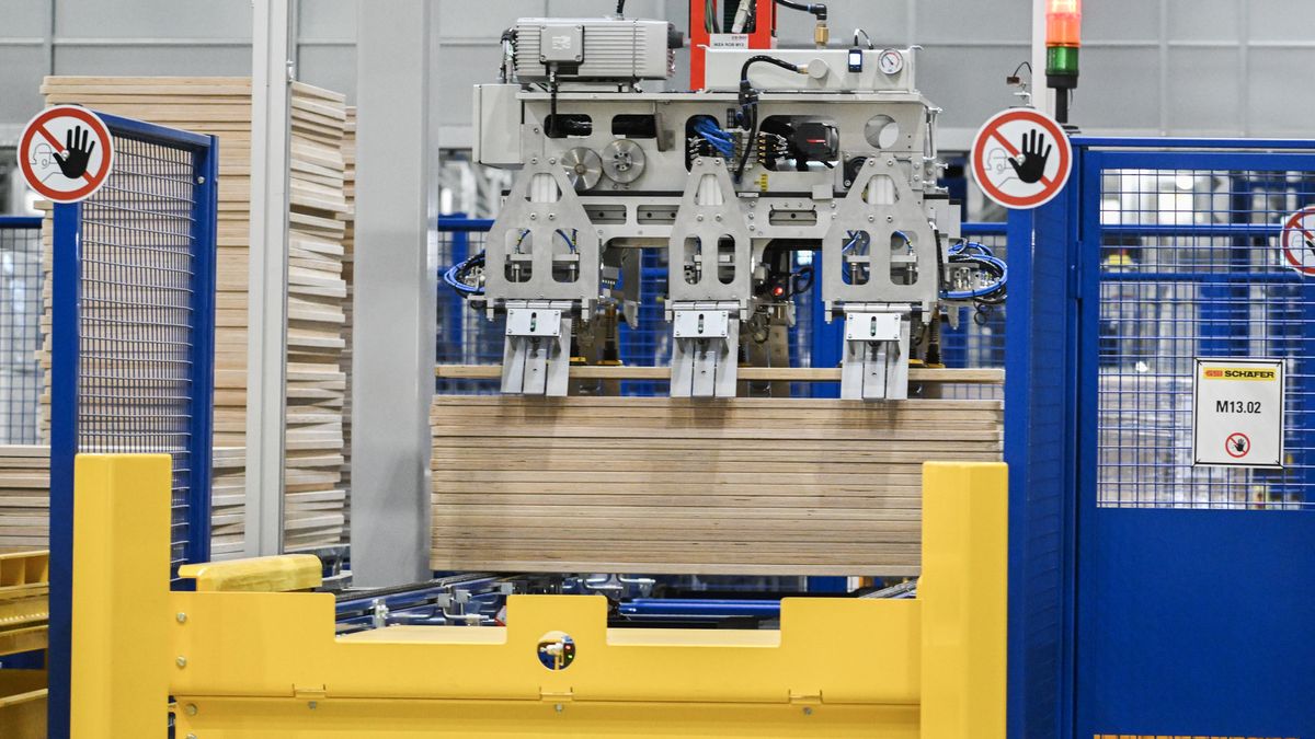 A robot picks up a wooden panel at a gantry at the Ikea distribution center in Beauharnois, Quebec, Canada, on Friday, Sept. 15, 2023. Ikea Canada is part of Ingka Group which operates 389 Ikea stores in 32 countries, including 14 in Canada. Photographer: Graham Hughes/Bloomberg via Getty Images