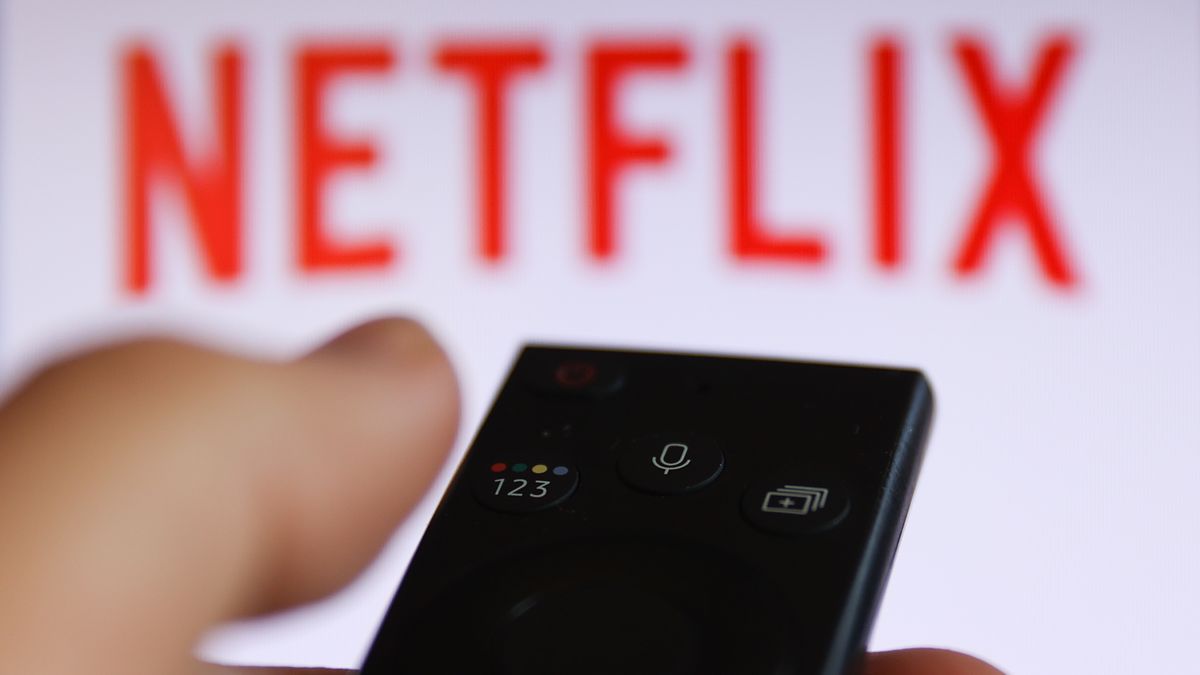 Netflix logo displayed on a tv screen and a tv remote control are seen in this illustration photo taken in Poland on August 6, 2024. (Photo by Jakub Porzycki/NurPhoto via Getty Images)