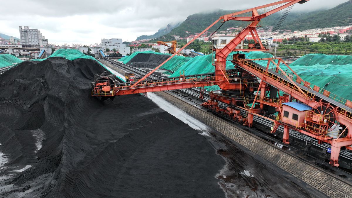 LIANYUNGANG, CHINA - JUNE 2, 2025 - Large machinery is piling up and storing thermal coal just unloaded from cargo ships at the coal terminal in Lianyungang Port City, Jiangsu Province, China on June 2, 2025. (Photo credit should read CFOTO/Future Publishing via Getty Images)